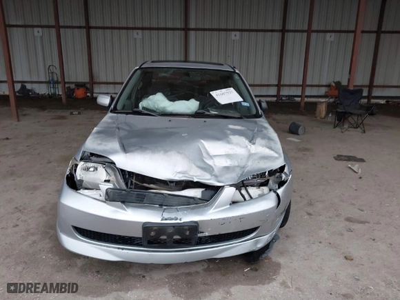 2003 Mazda Protege DX with VIN JM1BJ225030124381, listed as a IAAI auction lot 41607937 with 141,484 mi miles. Bid and sale history available at carsss.com. Image 12.