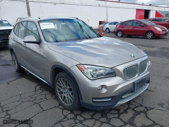 2014 BMW X1 xDrive28i with VIN WBAVL1C51EVY20556, listed as a IAAI auction lot 41699071 with 74,590 mi miles. Bid and sale history available at carsss.com. Image 1.