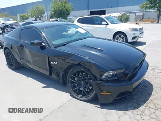 2014 Ford Mustang GT with VIN 1ZVBP8CF8E5296735, listed as a IAAI auction lot 42421815 with 98,920 mi miles and . Bid and sale history available at DreamBid. Image 1.