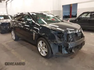 2014 Cadillac SRX Premium Collection z VIN 3GYFNGE38ES597450, wystawiony jako IAAI lot #41746191 z przebiegiem 121 630 mil mil oraz . Historia ofert i sprzedaży dostępna na DreamBid. Obrazek 1.