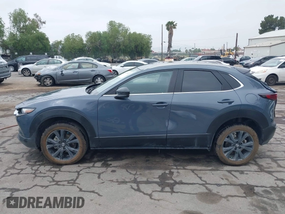 2022 Mazda CX-30 S Carbon Edition with VIN 3MVDMBCL0NM456154, listed as a IAAI auction lot 42153202 with 40,372 mi miles and . Bid and sale history available at DreamBid. Image 14.