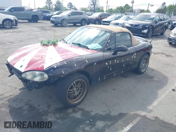 2004 Mazda MX-5 Miata LS with VIN JM1NB353040409951, listed as a IAAI auction lot 41848965 with 125,750 mi miles and . Bid and sale history available at DreamBid. Image 2.