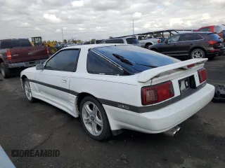 1987 Toyota Supra z VIN JT2MA70L2H0044216, wystawiony jako Copart lot #78864694 z przebiegiem 143 418 mil mil oraz Czysty tytuł • Clean title. Historia ofert i sprzedaży dostępna na DreamBid. Obrazek 2.