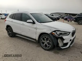 2019 BMW X1 sDrive28i with VIN WBXHU7C57K3H44192, listed as a Copart auction lot 49882335 with 79,350 mi miles and Salvage Title. Bid and sale history available at carsss.com. Image 4.