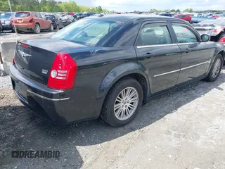 2009 Chrysler 300 Touring with VIN 2C3KA53V99H584082, listed as a IAAI auction lot 42026860 with 147,558 mi miles. Bid and sale history available at carsss.com. Image 4.