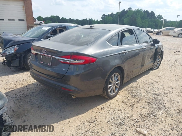 2017 Ford Fusion SE z VIN 3FA6P0H71HR410878, wystawiony jako IAAI lot #42135622 z przebiegiem 99 462 mil mil oraz . Historia ofert i sprzedaży dostępna na DreamBid. Obrazek 4.