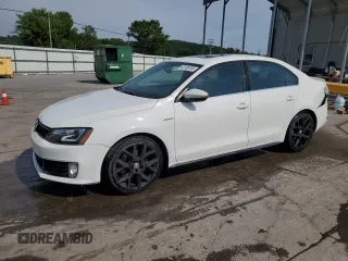 2014 Volkswagen Jetta GLI Autobahn with VIN 3VW5T7AJ2EM325246, listed as a Copart auction lot 62106185 with 105,648 mi miles and Salvage title. Bid and sale history available at DreamBid. Image 1.