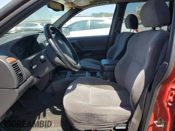 1999 Jeep Grand Cherokee Laredo z VIN 1J4G258SXXC518308, wystawiony jako Copart lot #56636235 z przebiegiem 233 649 mil mil oraz Szkoda całkowita • Salvage title. Historia ofert i sprzedaży dostępna na DreamBid. Obrazek 7.