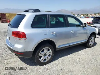 2005 Volkswagen Touareg z VIN WVGCM77L95D014940, wystawiony jako Copart lot #60156795 z przebiegiem 114 551 mil mil oraz Czysty tytuł • Clean title. Historia ofert i sprzedaży dostępna na DreamBid. Obrazek 3.