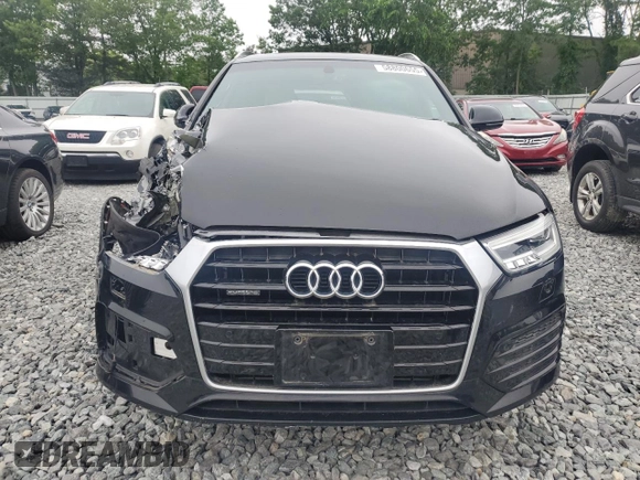 2017 Audi Q3 Prestige with VIN WA1GCCFS7HR001163, listed as a Copart auction lot 58800655 with 52,034 mi miles and Salvage title. Bid and sale history available at DreamBid. Image 5.