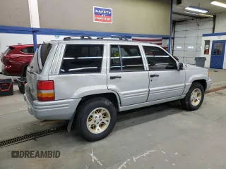 1998 Jeep Grand Cherokee Limited with VIN 1J4GZ78Y3WC216952, listed as a Copart auction lot 83239574 with 186,809 mi miles and Salvage Title. Bid and sale history available at carsss.com. Image 3.