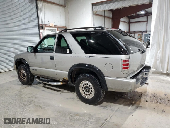 2000 Chevrolet Blazer LS z VIN 1GNCT18W9YK188091, wystawiony jako Copart lot #78592844 z przebiegiem 69 497 mil mil oraz Szkoda całkowita • Salvage title. Historia ofert i sprzedaży dostępna na DreamBid. Obrazek 2.