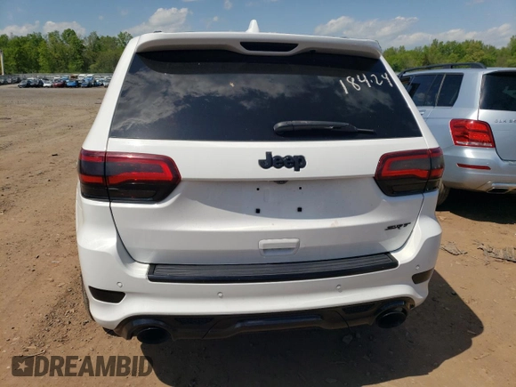 2018 Jeep Grand Cherokee with VIN NJ1449E, listed as a Copart auction lot 51357834 with 32,619 mi miles and Salvage title. Bid and sale history available at DreamBid. Image 6.