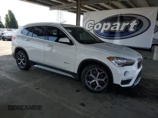 2017 BMW X1 xDrive28i with VIN WBXHT3C35H5F73546, listed as a Copart auction lot 59544545 with 125,185 mi miles and Salvage title. Bid and sale history available at DreamBid. Image 4.