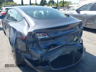 2023 Tesla Model 3 z VIN 5YJ3E1EA5PF401299, wystawiony jako IAAI lot #41968352 z przebiegiem 20 541 mil mil oraz . Historia ofert i sprzedaży dostępna na DreamBid. Obrazek 3.