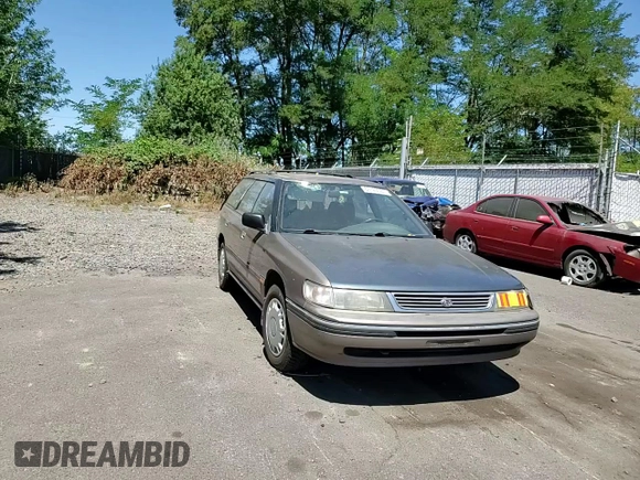 1993 Subaru Legacy L with VIN 4S3BJ6339P6948161, listed as a Copart auction lot 63123584 with 329,619 mi miles and Salvage Title. Bid and sale history available at DreamBid. Image 10.