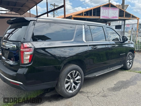 2021 Chevrolet Suburban LS with VIN 1GNSCBKD9MR480205, listed as a Copart auction lot 59422385 with 142,332 mi miles and Salvage title. Bid and sale history available at DreamBid. Image 4.