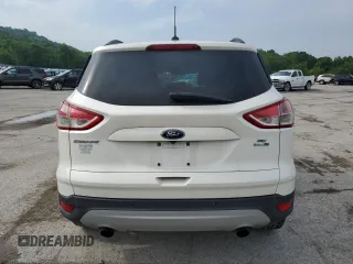 2016 Ford Escape SE z VIN 1FMCU9G97GUB45352, wystawiony jako Copart lot #60001055 z przebiegiem 93 685 mil mil oraz Szkoda całkowita • Salvage title. Historia ofert i sprzedaży dostępna na DreamBid. Obrazek 6.