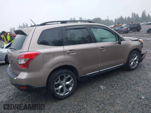 2015 Subaru Forester Touring with VIN JF2SJAUC1FH457069, listed as a IAAI auction lot 42293542 with 71,689 mi miles and . Bid and sale history available at DreamBid. Image 4.