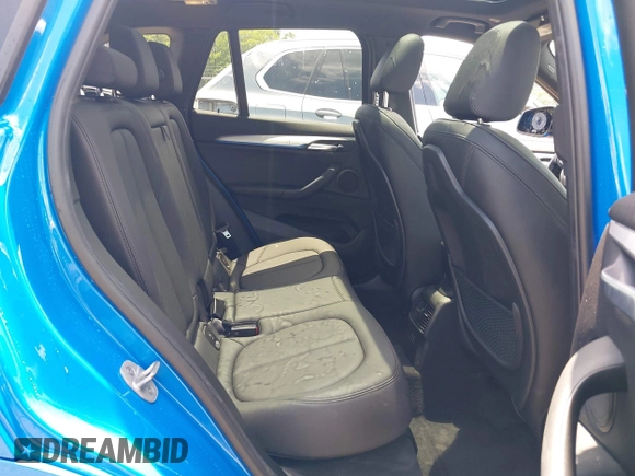 2021 BMW X1 xDrive28i with VIN WBXJG9C04M5T61811, listed as a IAAI auction lot 42509852 with 30,400 mi miles and . Bid and sale history available at DreamBid. Image 8.