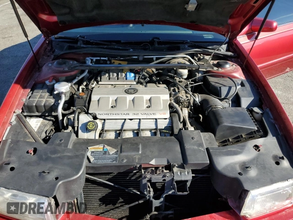 1999 Cadillac Eldorado Touring z VIN 1G6ET1293XU611368, wystawiony jako Copart lot #82683114 z przebiegiem 126 178 mil mil oraz Szkody całkowita. Historia ofert i sprzedaży dostępna na DreamBid. Obrazek 13.