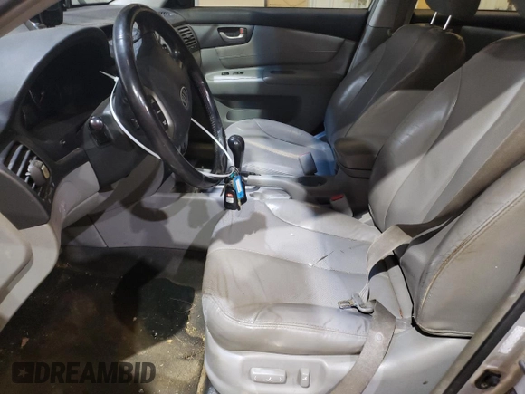 2007 Kia Optima EX with VIN KNAGE124675137864, listed as a Copart auction lot 87433434 with 141,682 mi miles and Salvage Title. Bid and sale history available at carsss.com. Image 7.