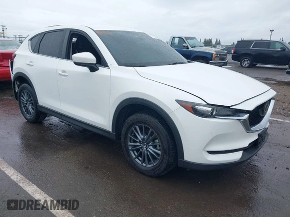 2020 Mazda CX-5 Touring with VIN JM3KFACM0L0738615, listed as a IAAI auction lot 41923923 with 52,599 mi miles. Bid and sale history available at carsss.com. Image 1.