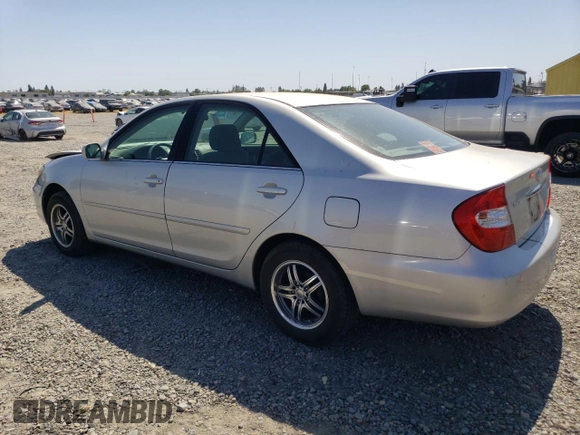 2002 Toyota Camry LE z VIN 4T1BE32KX2U037722, wystawiony jako Copart lot #58482805 z przebiegiem 154 207 mil mil oraz Szkoda całkowita • Salvage title. Historia ofert i sprzedaży dostępna na DreamBid. Obrazek 2.