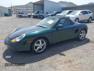 1999 Porsche Boxster with VIN WP0CA2986XU627495, listed as a IAAI auction lot 42112724 with 94,090 mi miles and . Bid and sale history available at DreamBid. Image 2.