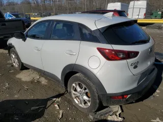 2016 Mazda CX-3 Touring with VIN JM1DKFC78G0140606, listed as a Copart auction lot 46979195 with 126,656 mi miles and Salvage Title. Bid and sale history available at carsss.com. Image 2.