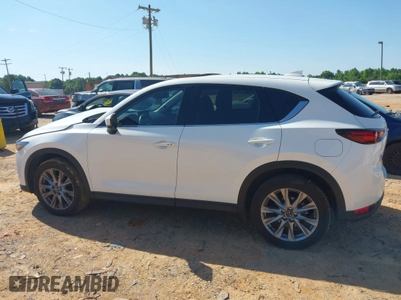 2021 Mazda CX-5 Grand Touring with VIN JM3KFBDM3M0493752, listed as a IAAI auction lot 42456854 with 35,122 mi miles and . Bid and sale history available at DreamBid. Image 14.