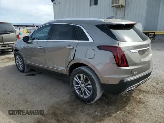 2022 Cadillac XT5 FWD Premium Luxury z VIN 1GYKNCRS9NZ180043, wystawiony jako Copart lot #51352195 z przebiegiem 12 399 mil mil oraz Szkoda całkowita • Salvage title. Historia ofert i sprzedaży dostępna na DreamBid. Obrazek 2.