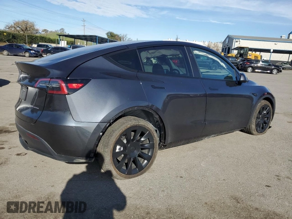 2025 Tesla Model Y Long Range with VIN 7SAYGDEE4SF272942, listed as a Copart auction lot 45817885 with 2,308 mi miles and Salvage Title. Bid and sale history available at DreamBid. Image 3.