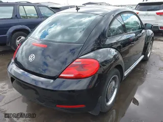 2012 Volkswagen Beetle 2.5L w/Sun/Sound/Nav PZEV with VIN 3VWHP7AT0CM623536, listed as a IAAI auction lot 41351333 with 106,600 mi miles. Bid and sale history available at carsss.com. Image 4.