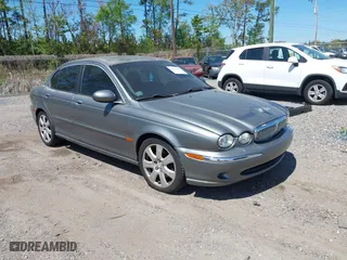 2004 Jaguar X-Type with VIN SAJEA51C04WD73023, listed as a IAAI auction lot 41874488 with 199,333 mi miles. Bid and sale history available at carsss.com. Image 1.