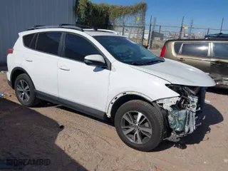 2017 Toyota RAV4 XLE with VIN JTMRFREV5HJ123412, listed as a IAAI auction lot 42018549 with 127,974 mi miles. Bid and sale history available at carsss.com. Image 1.