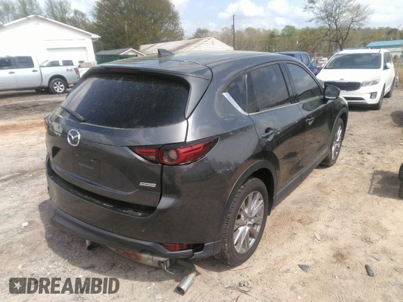 2019 Mazda CX-5 Grand Touring with VIN JM3KFBDM7K0606860, listed as a IAAI auction lot 41936338 with 93,057 mi miles. Bid and sale history available at carsss.com. Image 4.