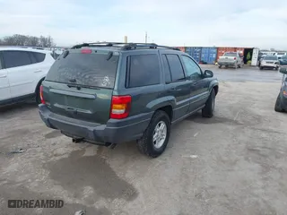 2003 Jeep Grand Cherokee Laredo with VIN 1J4GW48S93C583644, listed as a IAAI auction lot 41656314 with 256,653 mi miles. Bid and sale history available at carsss.com. Image 4.