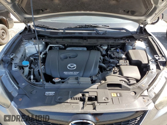 2014 Mazda CX-5 Sport with VIN JM3KE2BE7E0334880, listed as a Copart auction lot 61780635 with 96,926 mi miles and Salvage title. Bid and sale history available at DreamBid. Image 12.