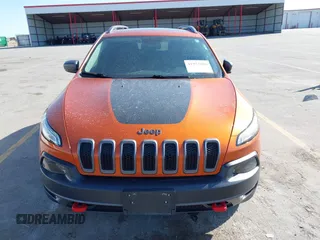 2016 Jeep Cherokee Trailhawk with VIN 1C4PJMBBXGW251682, listed as a IAAI auction lot 41973696 with 100,411 mi miles. Bid and sale history available at carsss.com. Image 13.