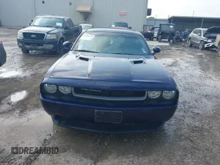 2013 Dodge Challenger SXT z VIN 2C3CDYAG9DH578888, wystawiony jako IAAI lot #42289139 z przebiegiem 121 649 mil mil oraz . Historia ofert i sprzedaży dostępna na DreamBid. Obrazek 12.