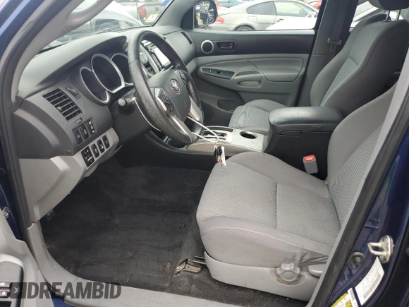 2015 Toyota Tacoma with VIN 3TMLU4EN6FM182144, listed as a Copart auction lot 64000365 with 185,361 mi miles and Clean title. Bid and sale history available at DreamBid. Image 7.