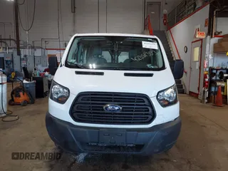 2015 Ford Transit Cargo with VIN 1FTNE1ZM8FKB17731, listed as a IAAI auction lot 42351353 with 74,489 mi miles and . Bid and sale history available at DreamBid. Image 12.