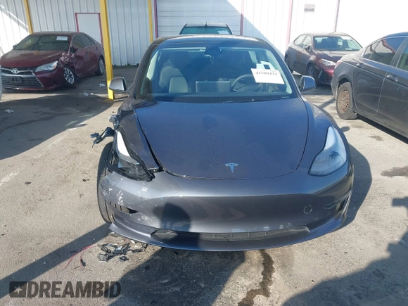 2023 Tesla Model 3 with VIN 5YJ3E1EA5PF697201, listed as a IAAI auction lot 41589422 with 16,862 mi miles and . Bid and sale history available at carsss.com. Image 12.