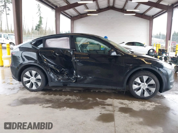 2023 Tesla Model Y Long Range with VIN 7SAYGAEE7PF739924, listed as a IAAI auction lot 41612323 with 75,226 mi miles and . Bid and sale history available at DreamBid. Image 12.
