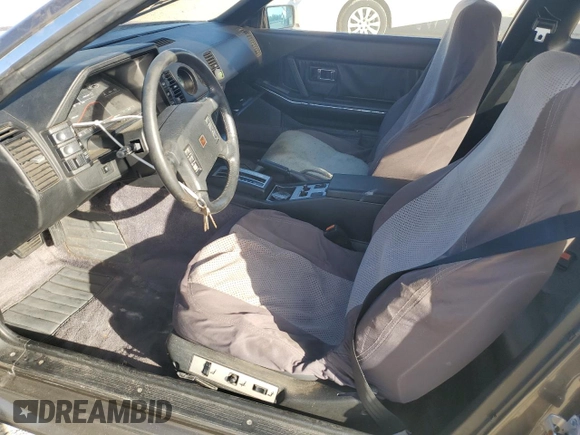 1986 Nissan 300ZX z VIN JN1HZ16S9GX094097, wystawiony jako Copart lot #75251134 z przebiegiem Nie podano mil oraz Szkoda całkowita • Salvage title. Historia ofert i sprzedaży dostępna na DreamBid. Obrazek 7.