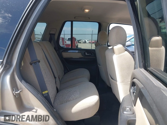 2005 GMC Envoy SLE with VIN 1GKDT13S252264932, listed as a IAAI auction lot 41981566 with 140,566 mi miles. Bid and sale history available at carsss.com. Image 8.