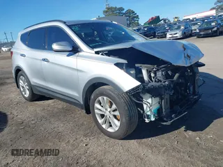 2018 Hyundai Santa Fe 2.0T z VIN 5XYZU4LAXJG513565, wystawiony jako IAAI lot #41811038 z przebiegiem 81 106 mil mil oraz . Historia ofert i sprzedaży dostępna na DreamBid. Obrazek 1.