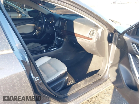 2014 Mazda 6 i Grand Touring with VIN JM1GJ1W50E1107877, listed as a IAAI auction lot 41857596 with 166,188 mi miles and . Bid and sale history available at DreamBid. Image 5.