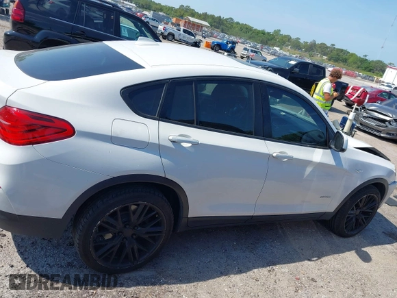 2015 BMW X4 xDrive28i with VIN 5UXXW3C59F0M88331, listed as a IAAI auction lot 42093953 with 138,205 mi miles and . Bid and sale history available at DreamBid. Image 13.